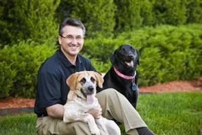 Scott Ragan, president and 'chief pet lover' of Three Dog Bakery, says on most days the company has up to 15 dogs on site, from a 9-pound Yorkie-Poo to a St. Bernard-Lab mix. 'At any given time, it can turn into recess here!'