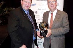 Dr. Clay Zimmerman (left) presents the New Frontiers award to Dr. George Fahey (right).