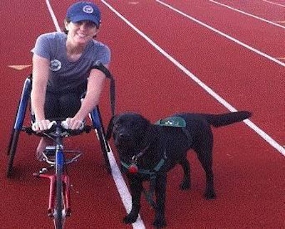 Kerri Morgan, 2012 Paralympian and bronze medalist, and her public access dog Twix. Morgan will give the opening keynote for Petfood Forum 2013.