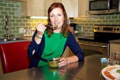 Lucy Postins, founder of the The Honest Kitchen, taste tests the ingredients in her company's dog food.