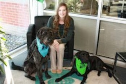 Lesley Gerard of Trouw Nutrition visits with Magnum (left) and Twister (right), both trained by C.H.A.M.P.