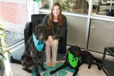 Lesley Gerard of Trouw Nutrition visits with Magnum (left) and Twister (right), both trained by C.H.A.M.P.