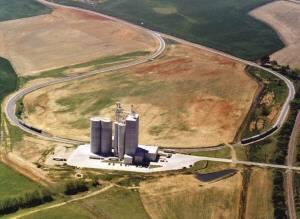 The innovative continuous loop rail spur at Tyson Foods' Talladega feed mill presently handles 65-car unit trains of corn. But Tyson feed milling director Tommy Robertson says the seven-year-old Talladega plant will take advantage of CSX railroad development incentives to take 90-car trains.