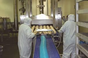 Oil browning of logs can kill surface bacteria prior to slicing.