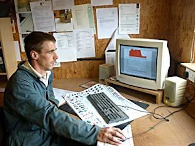 Checking piggery performance from the office. Farmer Anthony Williams logs in to look at environmental results in his finishing house.