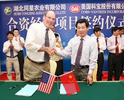 Cobb&rsquo;s Jerry Moye and Hubei Tong Xing Agriculture Co.&rsquo;s Yang Shenghong celebrate signing an agreement for a new joint venture company in China.