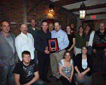Synergy production manager, Gary McAleer, accepts the award for top Cobb500 performance in Canada from Cobb&rsquo;s David Engel.