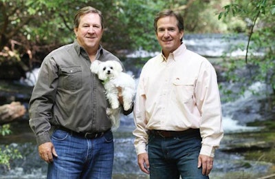 Jeff and Tommy Gay (seen here with Maltese Toby and Yellow Lab Chessie), brothers and co-founders of Big Creek Foods and the Look Who's Happy brand, aim to reach the top of the premium pet treats market with in-house production and the highest quality ingredients. | Courtesy Look Who's Happy