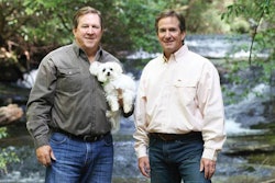 Jeff and Tommy Gay (seen here with Maltese Toby and Yellow Lab Chessie), brothers and co-founders of Big Creek Foods and the Look Who's Happy brand, aim to reach the top of the premium pet treats market with in-house production and the highest quality ingredients. | Courtesy Look Who's Happy