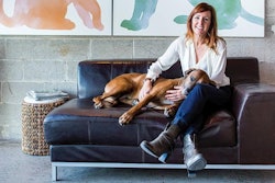 Courtesy The Honest Kitchen | The Honest Kitchen Founder and CEO Lucy Postins, here with Rhodesian Ridgeback Willow, has grown her company from its origins as an online, home-based business to a family-owned business focusing on expanding in the dehydrated pet food market.