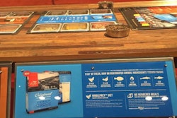 Champion Petfoods' booth at Global Pet Expo 2016 featured an innovative display for its Meatmath campaign: a bar of the actual, raw meats, fish, vegetables and other ingredients used in its food, plus clear graphics and text for each product showing the amount of meat, how much of it is fresh, whole, etc., and its source.