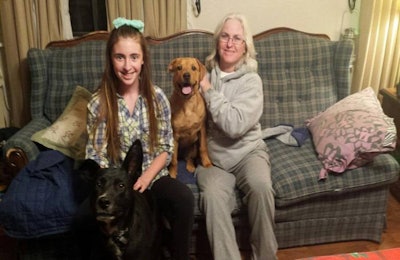 Purina Pro Plan 9 of 9 winner Laurie Neilson, her daughter, and dogs Ronnie and Mocha. | Courtesy Purina