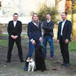 Founder and owner Jerry Xu, COO Jing Xu (not pictured), marketing specialist Paul Falla, supply specialist Bastian Thomann and sales specialist Tanja Huelsken are aiming to build a dominant presence in Europe’s specialty market. Also pictured: Labrador Retriever Savage Run Kieron and Forst-Parson Russell Terrier Lily vom Spanger. | Courtesy Vigor & Sage
