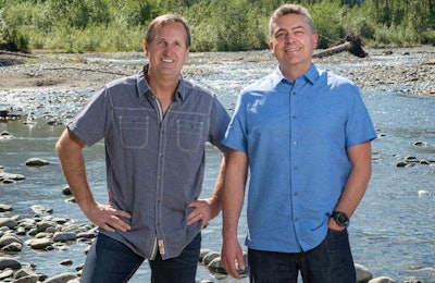 Long-time friends and Petcurean co-founders Ron Mayert and Dan Vanleeuwen take in the breathtaking view of the Vedder River in Chilliwack, British Columbia, Canada, minutes from the company’s head office. | Courtesy Petcurean Pet Nutrition