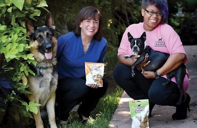 Linda Kramer, CEO of Daybreak, hopes to continue the success of Lindy and Company to the benefit of people like Ariel, a program alumna, while providing gourmet treats to pets like German Shepherd Tango and Boston Terrier Mattie. | Sharon Elaine Photography