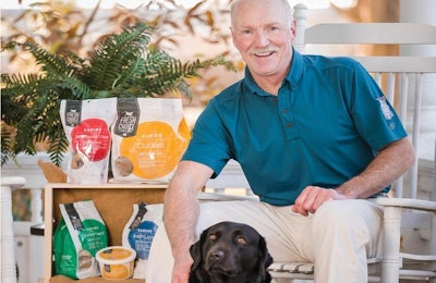 President Andrew Bullock, with his Black Lab Isabelle, aims to turn his young company into a leader in the raw/frozen pet food market | Waltz Photography LLC