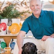 President Andrew Bullock, with his Black Lab Isabelle, aims to turn his young company into a leader in the raw/frozen pet food market | Waltz Photography LLC