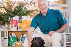 President Andrew Bullock, with his Black Lab Isabelle, aims to turn his young company into a leader in the raw/frozen pet food market | Waltz Photography LLC