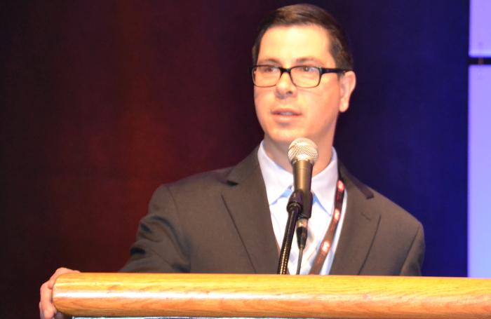 Matt Salois discusses some of the health risks associated with raising poultry without antibiotics. | Roy Graber