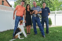 Best Breed Vice President Levi Wittenmyer, Dr. Toni Cotton, DVM, Founder Dr. Gary Cotton, DVM, and President Kent Benson, here with American Foxhound mix Walter and black cat Barney, focus on natural and holistic formulations to provide the best nutrition available to pets. | Courtesy Best Breed