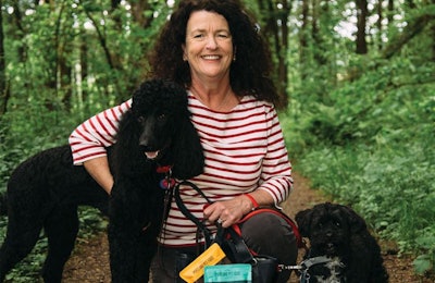 Portland Pet Food Founder and president Kate McCarron, here with her Standard Poodle Winnie and her Lasapoo Tuxedo, founded the company after another of her Standard Poodles, Rosie, had trouble eating traditional pet food due to health issues in her old age (14 years). A new company was born and Rosie lived to be 16.5 years old. | Photo by Henry Cromett