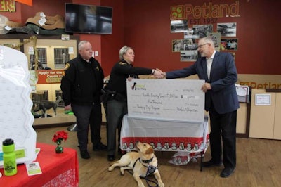 Photo by Petland Charities | From left to right, Franklin County Sergeant Jason Ratliff, Deputy Darrah Metz (Mattis handler), therapy dog Mattis and Petland Charities Director Ed Sayres.