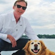 Isle of Dogs President John Hart, here with his Golden Retriever Indy, has married external pet beauty with internal pet health while expanding his business. | Photo courtesy Isle of Dogs