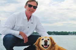 Isle of Dogs President John Hart, here with his Golden Retriever Indy, has married external pet beauty with internal pet health while expanding his business. | Photo courtesy Isle of Dogs