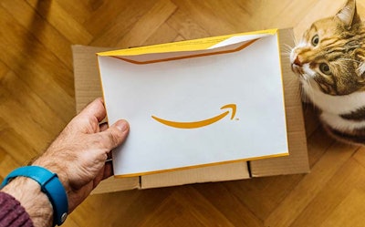 man-opening-Amazon-box-envelope-cat-helping