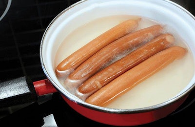 A performance artist provoked critical thinking about marketing hype by selling bottled hot dog water. | Photo by hamikus, iStock