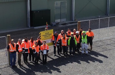 Members of the Cobb team stand outside of the Avian Transitional Facility in New Zealand. | Photo courtesy of Cobb-Vantress