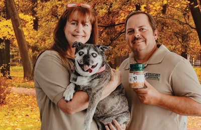 Victoria McDowell, CEO, here with Chief Operations Officer Jim Maciborski and Missy Mulligan McDowell the Bugg (Terrier/Pug mix) looks to constantly improve her company’s selections to help dog owners maintain optimal health for their pets. | Photo courtesy Miss Autumn’s Barquery