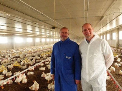 Josep Pinyol (left), a Spanish farmer, and Dr. Heiner Lehr, the developer of the robot, are testing out the potential of the technology on this farm near Lleida, Spain.