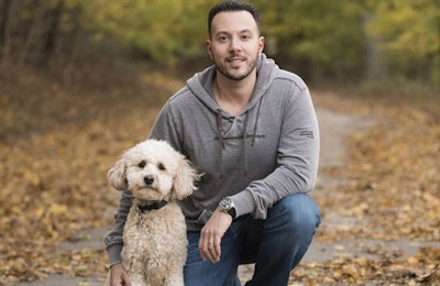 Brad Gruber, president and COO of Health Extension Pet Care, here with his Mini Goldendoodle Blaze, says that partnerships with their retailers and constant improvement have been vital to Health Extension’s success. | Photo courtesy Health Extension Pet Care