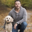 Brad Gruber, president and COO of Health Extension Pet Care, here with his Mini Goldendoodle Blaze, says that partnerships with their retailers and constant improvement have been vital to Health Extension’s success. | Photo courtesy Health Extension Pet Care