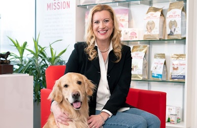 Kamie Eckert, here with her Golden Retriever Baxter, leads a team of 1,000 employees as president and general manager Royal Canin USA. l (Courtesy of Royal Canin)