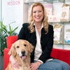 Kamie Eckert, here with her Golden Retriever Baxter, leads a team of 1,000 employees as president and general manager Royal Canin USA. l (Courtesy of Royal Canin)