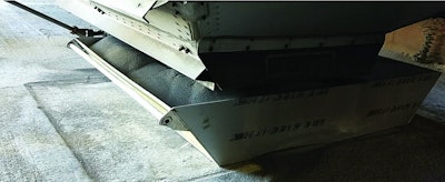 Funnel devices are used over the bulk receiving pit to contain product and reduce spillage on the floor. Product spilled on the bulk receiving floor is cleaned up, discarded and not swept in the pit. (Courtesy United Animal Health)