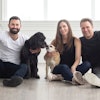 Open Farm co-founders Derek Beigleman, Jacqueline Prehogan and Isaac Langleben, here with Golden Retriever mix Molly and Puggle Bella, wants to lead the pet food industry towards sustainability by changing the way pet food is sourced and produced. | (Courtesy Open Farm)