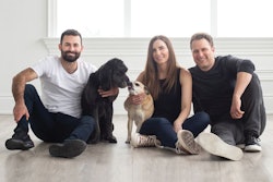 Open Farm co-founders Derek Beigleman, Jacqueline Prehogan and Isaac Langleben, here with Golden Retriever mix Molly and Puggle Bella, wants to lead the pet food industry towards sustainability by changing the way pet food is sourced and produced. | (Courtesy Open Farm)