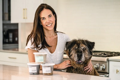 Bramble Founder and CEO Amanda Rolat, here with one of her dogs McGruff, says her animals and their needs were what drove her to start her fresh, plant-based pet food company. | (Photo by Stacey Axelrod)