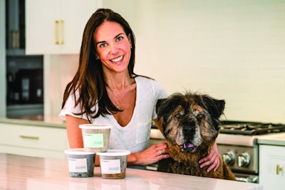 Bramble Founder and CEO Amanda Rolat, here with one of her dogs McGruff, says her animals and their needs were what drove her to start her fresh, plant-based pet food company. | (Photo by Stacey Axelrod)