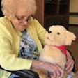 Former Army Nurse Cathy McDonough Drake with robotic dog