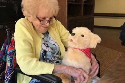 Former Army Nurse Cathy McDonough Drake with robotic dog