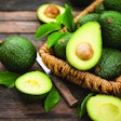 Fresh organic avocado on the wooden table