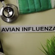 Avian Influenza with inspiration and healthcare/medical concept on desk background