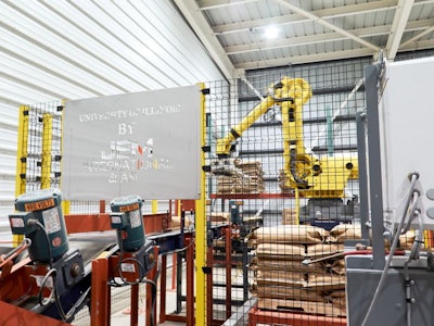 After finished feed has passed through the JEM International automated bagging system, a robot places the bags on pallets. (Ann Reus)