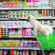 Bangkok, Thailand - April 8, 2017 : Dog so cute wait a pet owner shopping by selecting a variety accessories or pet food from pet goods shelf in petshop for her dog open daily for service everyday.