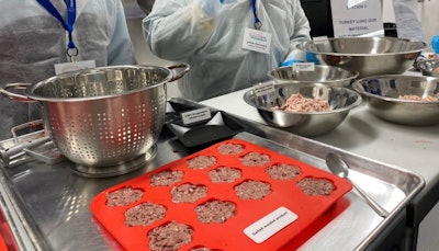 During the Petsure Imaginarium seminar at Auburn University, participants made pet treats with meat co-products, guided by students researching the concept.