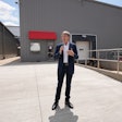 Chris Nelson, CEO of Kemin Industries, addresses participants at the opening of Kemin Nutrisurance's wet pet food pilot lab in Des Moines, Iowa, USA.